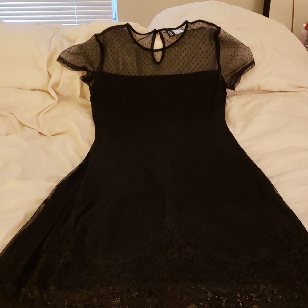 Super cute black lace dress never been worn.